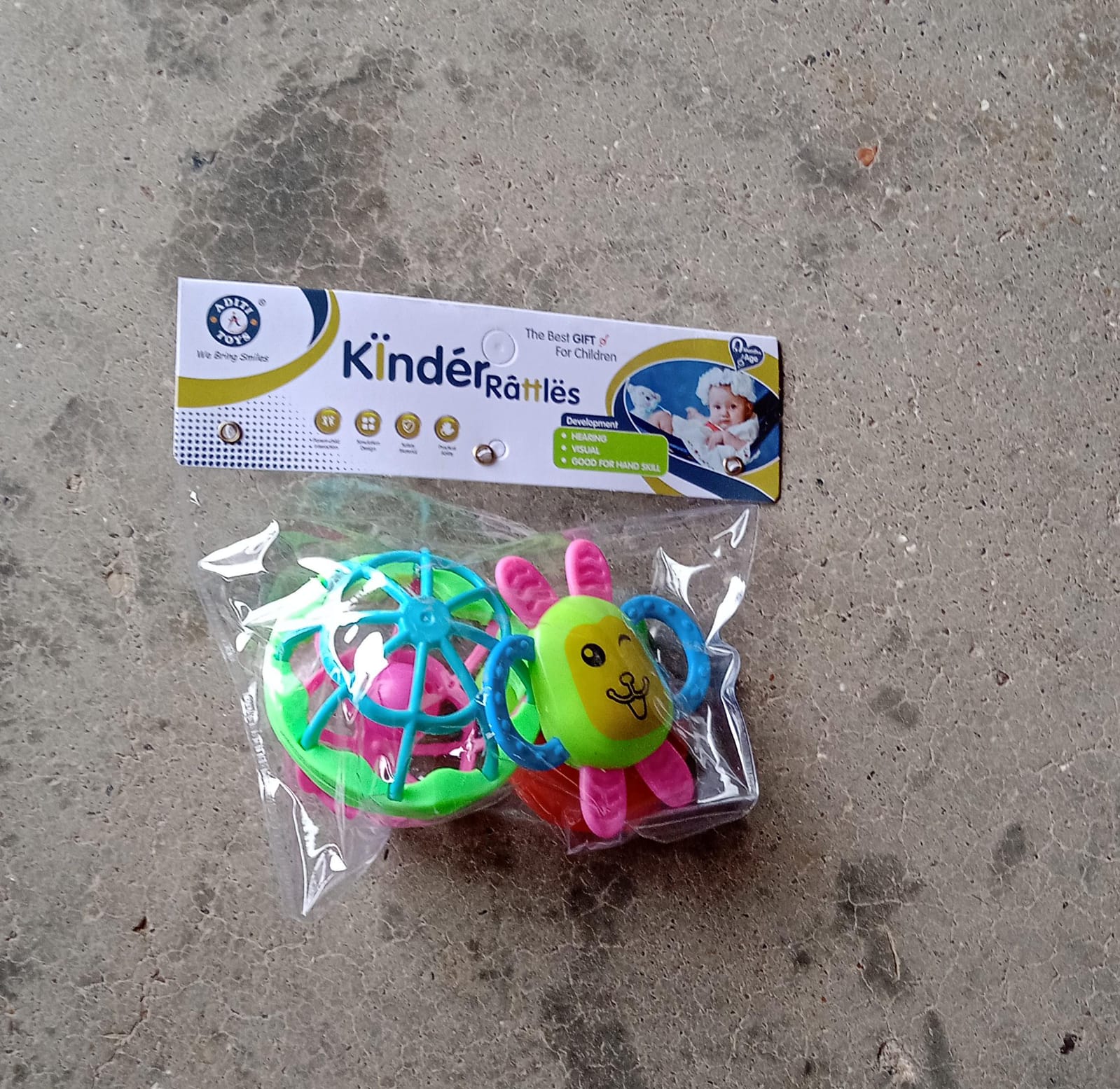 Collection of three colorful baby rattles designed for play and sensory development. Collection of three colorful baby rattles designed for play and sensory development.
